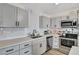 Stylish kitchen boasts stainless steel appliances, sleek gray cabinetry, and quartz countertops at 1804 David Ave, Las Vegas, NV 89101