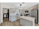 Updated kitchen features stainless steel appliances, gray cabinets, and white subway tile backsplash at 1804 David Ave, Las Vegas, NV 89101