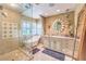 Luxurious bathroom features a freestanding tub, glass-enclosed shower, and elegant vanity with double sinks at 1844 Winners Cup Drive, Las Vegas, NV 89117