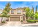 Charming two-story home featuring a well-manicured front yard and a two-car garage at 1844 Winners Cup Drive, Las Vegas, NV 89117