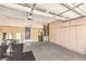 Spacious garage with ample storage cabinets, mirrors, and exercise equipment at 1844 Winners Cup Drive, Las Vegas, NV 89117