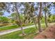 Picturesque greenbelt featuring a walking path, mature trees, and well-maintained landscaping at 1844 Winners Cup Drive, Las Vegas, NV 89117