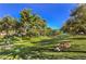 Beautiful greenbelt with mature trees and a walking path, creating a serene and inviting outdoor space at 1844 Winners Cup Drive, Las Vegas, NV 89117