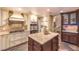 Spacious kitchen featuring an island, stainless steel appliances, and custom cabinetry at 1844 Winners Cup Drive, Las Vegas, NV 89117