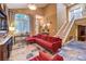Spacious living room featuring high ceilings, tile floors, lots of light, and staircase access at 1844 Winners Cup Drive, Las Vegas, NV 89117