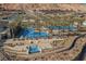 Community pool and lounge area with palm trees at 19 Desert Ivy Ln, Henderson, NV 89011