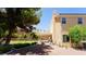 Private backyard with mature trees, patio area, and low-maintenance desert landscaping at 2017 Shining Feather Ln, Las Vegas, NV 89134
