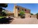 Backyard with a covered patio, desert landscaping, and privacy fencing at 2017 Shining Feather Ln, Las Vegas, NV 89134