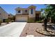 Charming two-story home featuring a spacious driveway and a well-manicured yard in a desirable neighborhood at 2017 Shining Feather Ln, Las Vegas, NV 89134