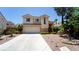 Charming two-story home featuring a spacious driveway and a well-manicured yard in a desirable neighborhood at 2017 Shining Feather Ln, Las Vegas, NV 89134