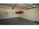 Clean, bright garage with built in storage cabinets and white door at 2017 Shining Feather Ln, Las Vegas, NV 89134