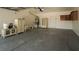 Large garage with storage cabinets and ample space for multiple cars or projects at 2017 Shining Feather Ln, Las Vegas, NV 89134