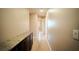 Hallway area featuring hardwood floors, light walls and a granite countertop at 2017 Shining Feather Ln, Las Vegas, NV 89134