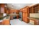Modern kitchen featuring stainless steel appliances, granite countertops, and custom cabinetry at 2017 Shining Feather Ln, Las Vegas, NV 89134
