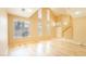Bright living room with staircase, hardwood floors, and large windows at 2017 Shining Feather Ln, Las Vegas, NV 89134