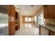 Open-concept room showcasing tile floors, a fireplace, and kitchen access at 2017 Shining Feather Ln, Las Vegas, NV 89134