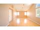 Spacious main bedroom with vaulted ceiling, wood floors, and bright windows at 2017 Shining Feather Ln, Las Vegas, NV 89134