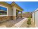 Charming back patio area with brick pillars, pavers, and landscaped accents at 209 Bennett Pointe Ave, Henderson, NV 89011