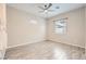 Bright bedroom with a ceiling fan, tile flooring, and large windows offering lots of natural light at 209 Bennett Pointe Ave, Henderson, NV 89011