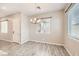Comfortable dining space with wood-look floors and natural lighting at 209 Bennett Pointe Ave, Henderson, NV 89011