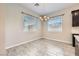 Cozy dining area with modern flooring and an elegant chandelier at 209 Bennett Pointe Ave, Henderson, NV 89011
