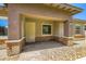 Inviting exterior view showcasing the covered entryway with brick columns at 209 Bennett Pointe Ave, Henderson, NV 89011