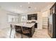 Open kitchen concept with granite countertops, modern appliances and island seating at 209 Bennett Pointe Ave, Henderson, NV 89011