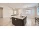 Stylish kitchen featuring a large island with seating and stainless steel appliances at 209 Bennett Pointe Ave, Henderson, NV 89011