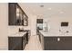 Modern kitchen boasting stainless steel appliances and a large center island at 209 Bennett Pointe Ave, Henderson, NV 89011