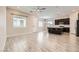 Open-concept living area with modern floors and a view of the kitchen island at 209 Bennett Pointe Ave, Henderson, NV 89011