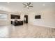 Bright, open living space featuring a kitchen island and a ceiling fan at 209 Bennett Pointe Ave, Henderson, NV 89011
