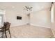 Spacious living room featuring modern floors, a ceiling fan, and ample natural light at 209 Bennett Pointe Ave, Henderson, NV 89011