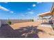 A wide shot of the backyard on a sunny day showing the block fence at 2111 Hollow Oak Ave, North Las Vegas, NV 89031