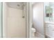 Bathroom showcasing a white shower stall, toilet, and vanity area with a sink at 2111 Hollow Oak Ave, North Las Vegas, NV 89031