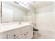 Bathroom featuring a shower-tub combo, toilet, and a vanity with sink and mirror at 2111 Hollow Oak Ave, North Las Vegas, NV 89031