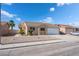 Well-maintained home with desert landscaping and an attached two-car garage at 2111 Hollow Oak Ave, North Las Vegas, NV 89031