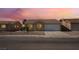 Charming single-story home featuring a two-car garage and low-maintenance desert landscaping at 2111 Hollow Oak Ave, North Las Vegas, NV 89031