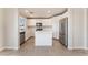 A modern kitchen with stainless steel appliances, white cabinets, and a center island at 2111 Hollow Oak Ave, North Las Vegas, NV 89031