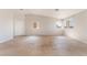 Inviting living room with tile floors, featuring large windows for ample natural light at 2111 Hollow Oak Ave, North Las Vegas, NV 89031