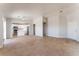 Spacious living room featuring tile flooring, ceiling fan and views into kitchen at 2111 Hollow Oak Ave, North Las Vegas, NV 89031