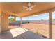 Covered patio with ceiling fans overlooking a large backyard space at 2111 Hollow Oak Ave, North Las Vegas, NV 89031