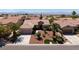 An aerial view of a charming single-story house in a residential community with mountain views at 2131 Waterton Rivers Dr, Henderson, NV 89044