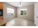 Dining area features tile floors and natural light from the two large windows at 2131 Waterton Rivers Dr, Henderson, NV 89044