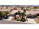 Well-maintained single-story home featuring a lush front yard with desert landscaping and a two-car garage at 2131 Waterton Rivers Dr, Henderson, NV 89044