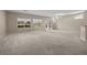 Spacious living room with carpet, natural light, and slider to the backyard at 2131 Waterton Rivers Dr, Henderson, NV 89044