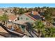 Aerial view of a home with solar panels and a shaded backyard patio area at 2204 W San Miguel Ave, North Las Vegas, NV 89032