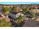An aerial view of a home shows solar panels and a cozy backyard patio at 2204 W San Miguel Ave, North Las Vegas, NV 89032