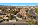 Elevated view of home, complemented by solar panels and lush neighborhood landscape at 2204 W San Miguel Ave, North Las Vegas, NV 89032