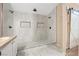 Newly renovated bathroom with tiled shower, dual shower heads, and sink at 2204 W San Miguel Ave, North Las Vegas, NV 89032