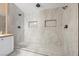 Recently renovated bathroom with tiled shower, dual shower heads, and sink at 2204 W San Miguel Ave, North Las Vegas, NV 89032